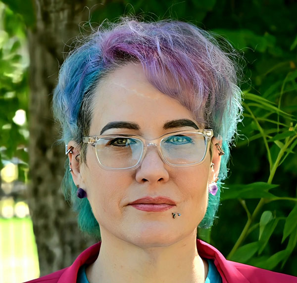 Woman with blue, purple, and green hair